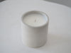 Makana concrete candle on rustic white stool 